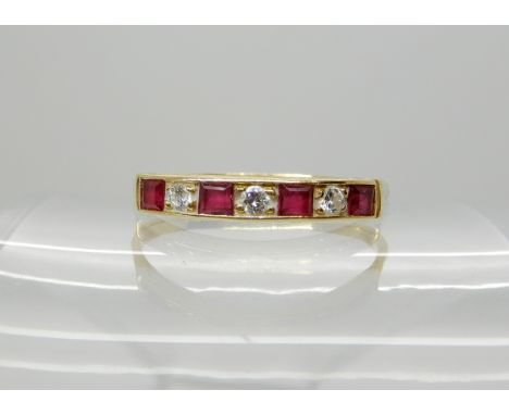 An 18ct gold ruby and diamond half eternity ring, size V1/2, weight 2.6gms Condition Report: Available upon request