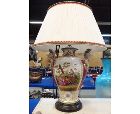 A large continental table lamp painted with scenes of figures in a landscape Condition Report: Available upon request