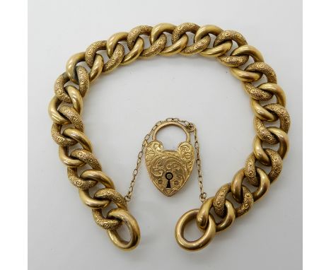 A 9ct gold curb link bracelet with engraved detail, with a heart shaped clasp, length 20cm, weight 25.3gms Condition Report:H