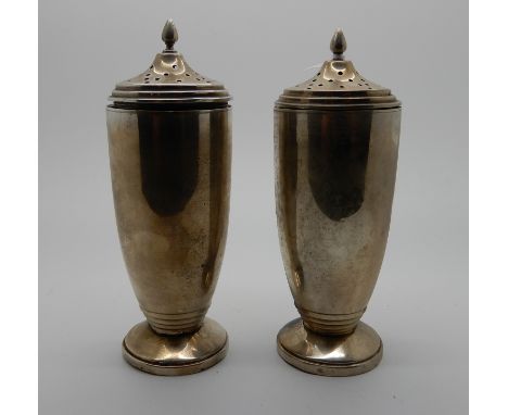 A pair of silver sugar castors by Sanders &amp; MacKenzie, Birmingham 1937, 15cm high, 296gms Condition Report: Available upo