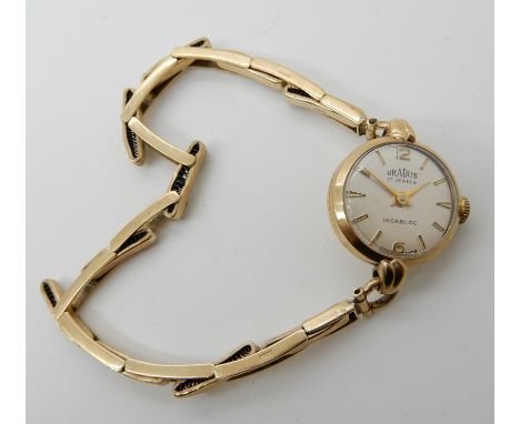 A 9ct Gradus ladies vintage watch and expanding strap, weight including mechanism 11.5gms Condition Report: Available upon re