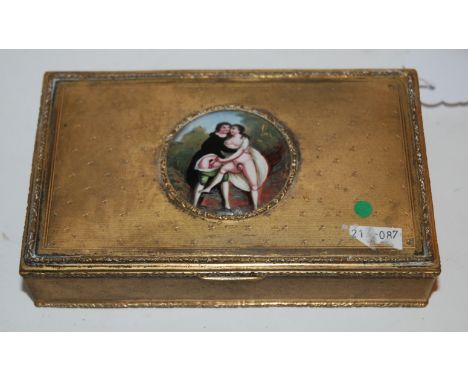 A gilt-metal box, the lid decorated with a circular enamel panel of an erotic scene, 14cm wide Condition Report: Available up