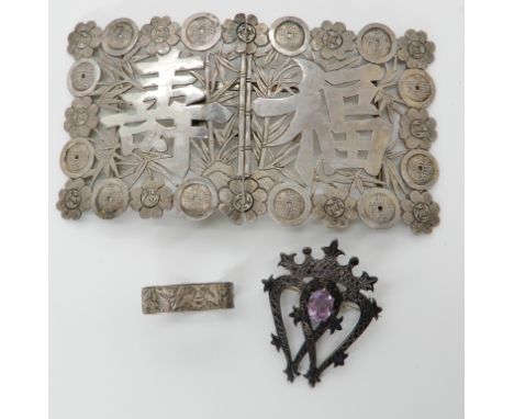 A John Hart of Iona silver luckenbooth brooch set with an amethyst, a Chinese white metal buckle and a cravat clip Condition 
