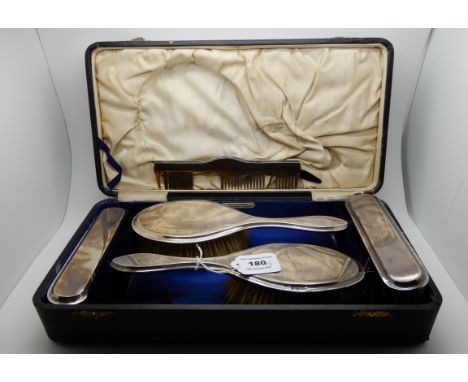 A part silver mounted dressing table set, Birmingham 1938, lacking mirror (5) Condition Report: Available upon request