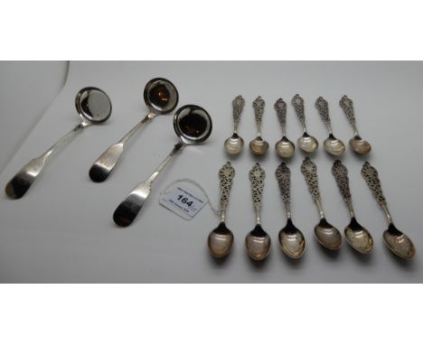 A lot comprising a set of twelve silver teaspoons (loose), Sheffield 1897 and three silver sauce ladles, Edinburgh 1844 (15),