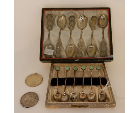 A lot comprising a cased set of six white metal oriental style teaspoons, a cased set of six coffee spoons with jadeite set t