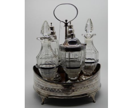 A matched silver and glass five-bottle cruet stand, the frame London 1805 Condition Report: The frame wobbles a bit as one fo