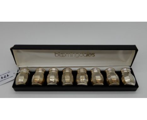 A cased set of eight sterling silver pepperettes, 66gms (the box marked Bloomingdales) Condition Report: Available upon reque