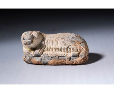 Middle Kingdom, Reign of Amenemhat III 1853-1806 BC.
A steatite scaraboid in the form of a reclining hippo, made in a natural