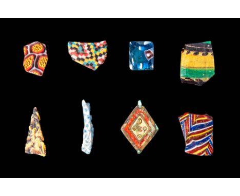 Ca. 30 BC - AD 200.
A set of eight mosaic glass inlays, including millefiori, chequerboard, trails, and eye motifs; each piec