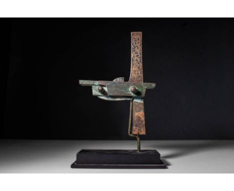 Ca. 206 BC - AD 220.A Chinese Han dynasty gold and silver inlaid bronze crossbow trigger decorated in various parts assembled