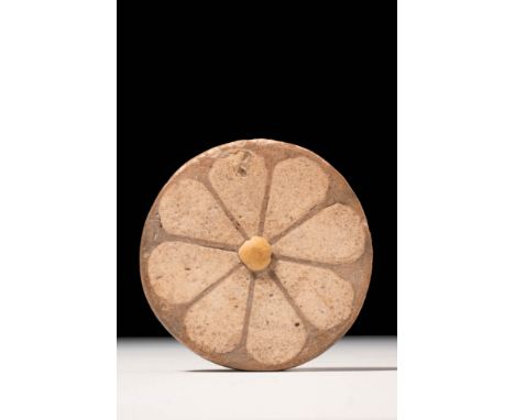 New Kingdom, 20th Dynasty, Ca. 1184 - 1153 BC.
A glazed faience inlay in the form of a rosette, set with eight petals around 