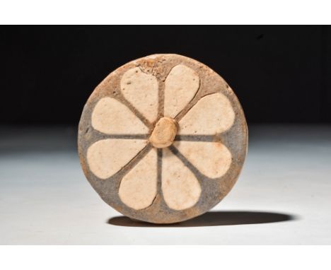 New Kingdom, 20th Dynasty, Ca. 1184 - 1153 BC.
A glazed composition inlay in the form of a rosette, set with creamy white pet