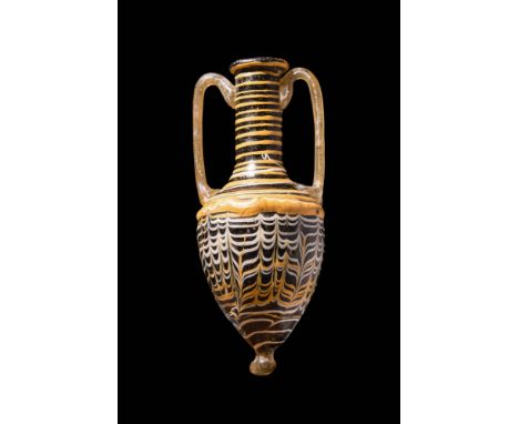 Ca. 200 BC - AD 100 .
A superb core-formed glass amphoriskos, once used to hold perfumed oil. This vase has an inverted pyrif