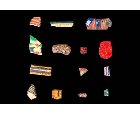 Ca. 30 BC - AD 200 .
A set of 14 mosaic glass Inlays, each in multicoloured hues and varying shapes. Most fragments display s