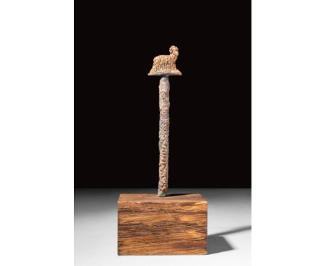 Ca. 2500 - 1700 BC .
A bronze pin with a gold ram finial at the top. The ram is rendered in a naturalistic manner, featuring 