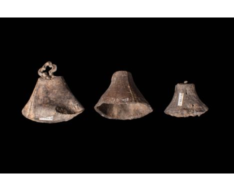 Ca. AD 1200 - 1500.
A group of four bronze hawking bells with conical body. The bell on the left has a cross shaped loop, dec