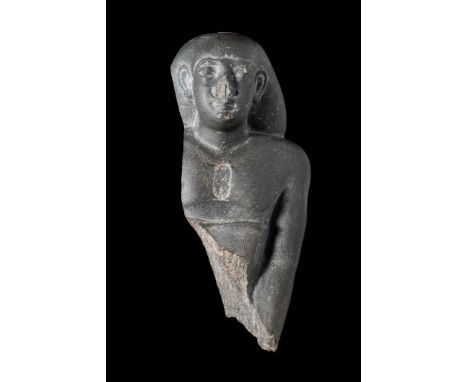 Late Period, 26th Dynasty, Reign of Necho II, Ca. 610 - 595 BC.
A greywacke statuette of a high official of the pharaoh Nacho