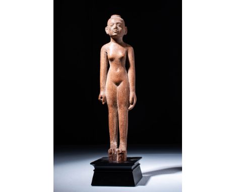 New Kingdom, 18th Dynasty.A wonderful example of a hand-carved wooden female figure, likely a servant in a tomb scene depicti