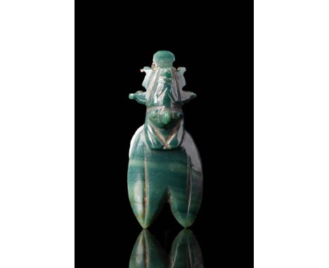 Late to Ptolemaic Period, Ca. 664 - 30 BC.
An amulet of a crowned Horus with the body of a cicada, made of jade and perforate