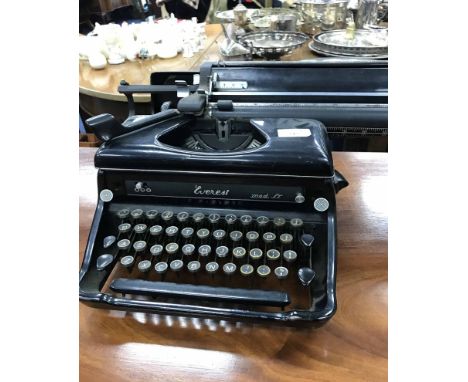 TWO PORTABLE SEWING MACHINEStogether with a typewriter