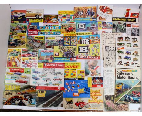 A collection of vintage pocket catalogues from Corgi, Dinky, Matchbox, Britains and others, with specific examples including 