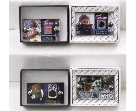 A collection of The Movie Reliquary Screen used Doctor Who props encased in acrylic cases to include a piece from an original