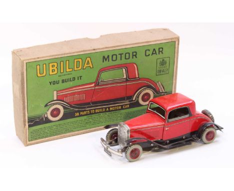 Chad Valley Ubilda motor car comprising of various tinplate components to construct a motorcar, body is finished in red with 