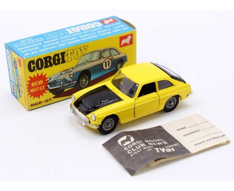 Corgi Toys No. 345 MGC GT competition model comprising of a yellow and black body with wirework hubs, with suitcase to the bo