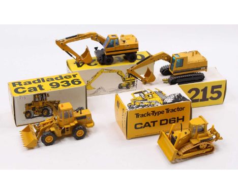 A collection of four boxed Caterpillar 1/50 scale earth moving and construction diecast vehicles to include an NZG No. 259 Ca