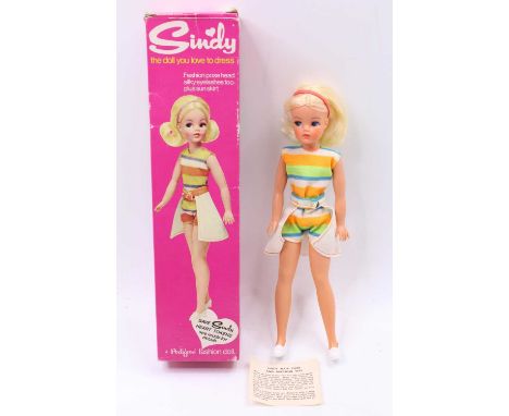 A Pedigree No. S676 Sindy Doll dressed in beach outfit, with white skirt &amp; shoes, and red hairband, with 033 055X to the 