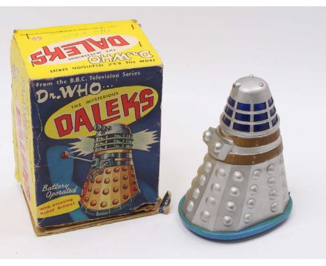 A Marx battery-operated Dalek from the BBC Television Series "Dr Who", silver plastic body with a light blue base, missing at