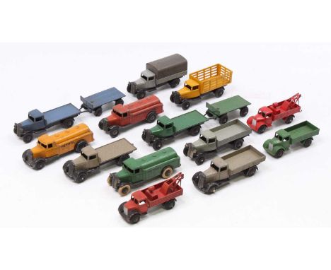 A collection of Dinky Toys mostly 25 Series Trucks, Wagons, and Petrol Tankers in play-worn condition