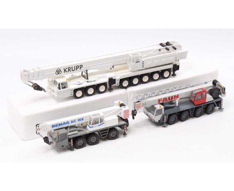 A collection of 1/50 scale heavy haulage model cranes to include a Conrad No. 2086 Demag AC155 six wheel mobile crane, a Conr