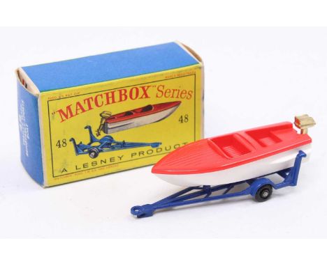 Matchbox No. 48 trailer with removable sports boat comprising of dark blue trailer with black plastic wheels, red and white b