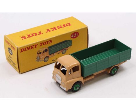 Dinky Toys No. 431 Guy Warrior 4-ton lorry comprising a tan cab, dark green back, and mid-green hubs, no windows fitted, some