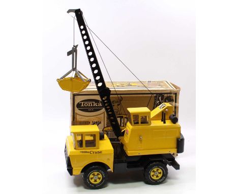 A Tonka Toys USA No. 3940 Mighty Tonka Mobile Crane, pressed steel body in yellow &amp; black, with black plastic components,