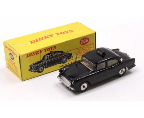 Dinky Toys No. 256 Police Patrol Car, black body, with a cream interior, 2 figures, and spun hubs, sold in the original all c