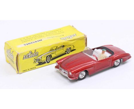 Solido Mercedes 190 SL Cabriolet comprising a metallic red body, with a white interior, spun hubs, and driver figure, sold in