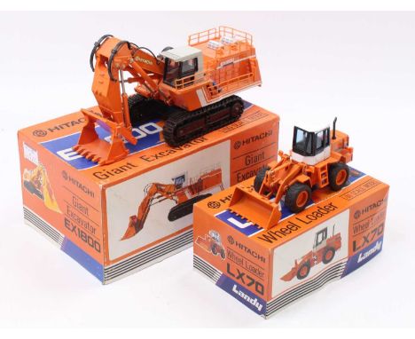 A Hitachi Shinsei 1/60 scale diecast model of a Giant Excavator, together with another Shinsei Hitachi LX70 1/40 scale wheel 