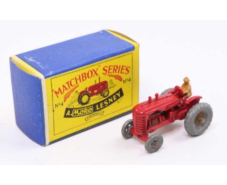 Matchbox Lesney No. 4a Massey Harris Tractor in red with mudguards, gold trim and driver figure, sold in the original 1st iss