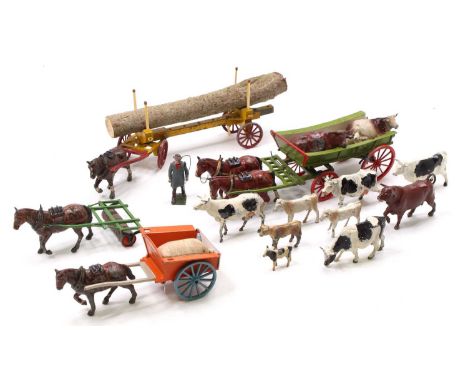 A collection of Britains and Charbens farming horse drawn vehicles including a Britains open farm wagon, a Charbens Log Carri