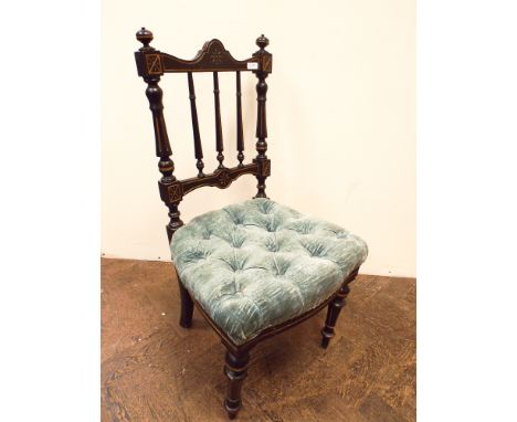 A late Victorian ebonised stick back occasional chair with blue buttoned upholstered seat 