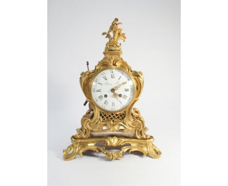French decorative gilt ormolu striking mantel clock, stamped Raingo Frea and underneath Paris - height is 39cm      Condition