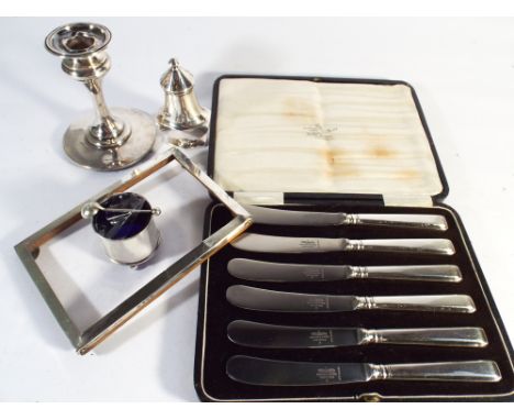 1930s hallmarked silver pepper pot, salt cellar and spoon, rectangular photograph frame and a chamber stick together with a s