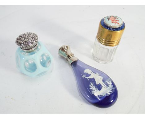 3 glass scent bottles to include amethyst Mary Gregory example (10cm long), one with Cherub and enamel top and another turquo