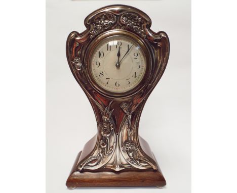 An Art Nouveau Mahogany balloon clock with silver faced floral panels to the front 31.5cms tall Birmingham hallmarks to the s