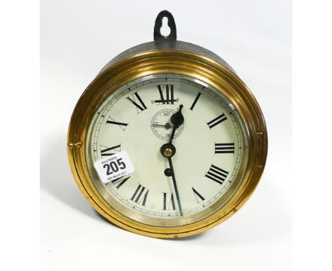 A circular brass and metal ships wall clock - 7 1/4" diameter