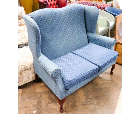 Wing backed 2 seater navy blue sofa on cabriole legs 