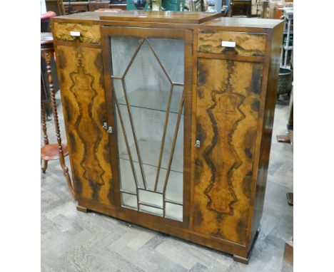 Art Deco walnut cabinet with fitted cupboards and sunburst glazed centre section, 3'6 wide